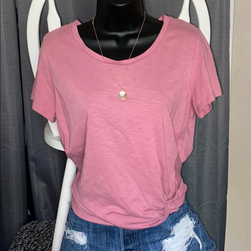 Women’s light pink top.
